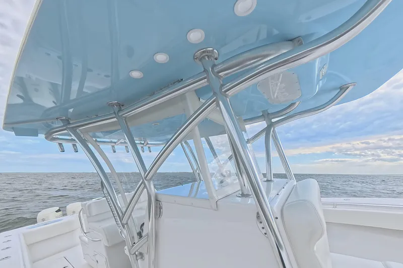 Slide: The Image of 2019 SeaHunter 33 Tournament boat with sleek design and ocean backdrop. - 32