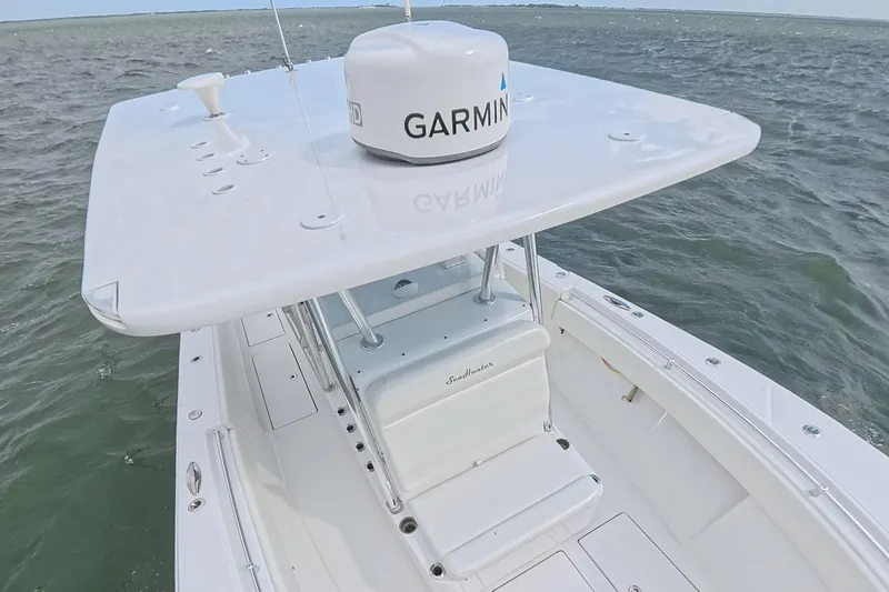 Slide: The Image of 2019 SeaHunter 33 Tournament boat with Garmin equipment on open water. - 33