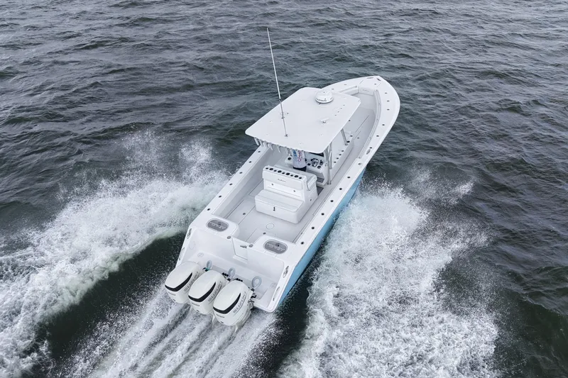 Slide: The Image of 2019 SeaHunter 33 Tournament boat cruising on open water, aerial view. - 40