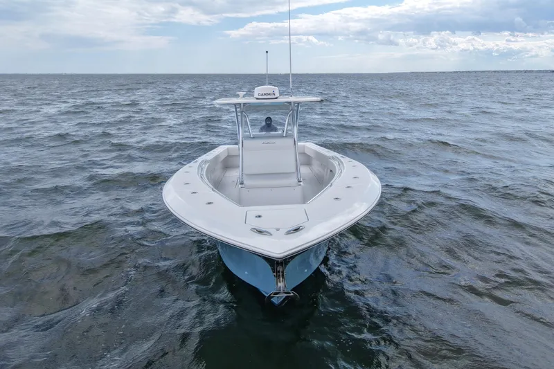 Slide: The Image of 2019 SeaHunter 33 Tournament boat on open water, featuring Garmin equipment. - 7
