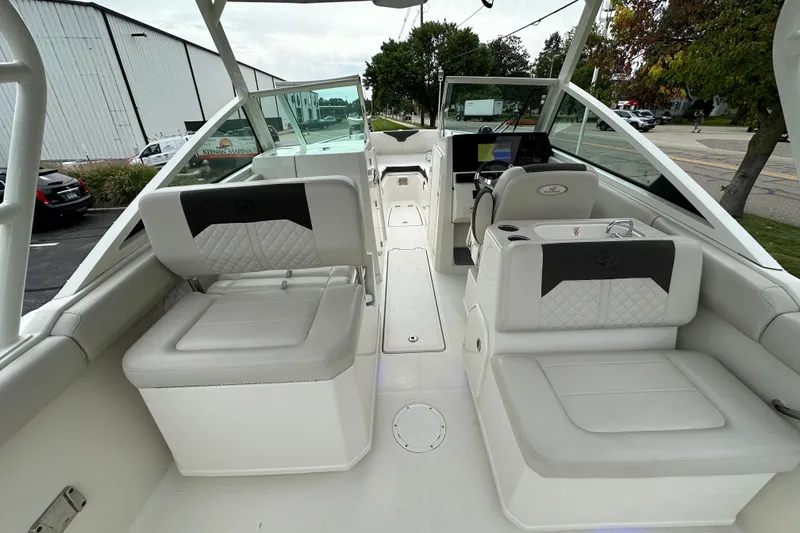 Slide: The Image of 2021 Sailfish 276 DC boat interior with white seating and helm station. - 5