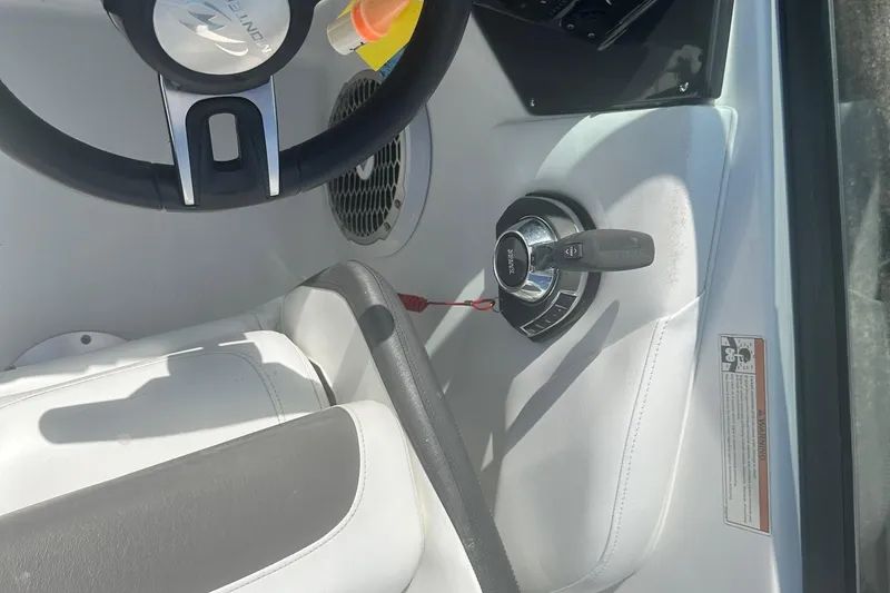 Slide: The Image of Steering wheel and controls of a 2020 Monterey M4 boat interior. - 32