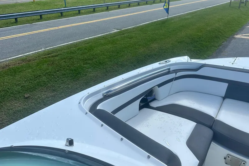 Slide: The Image of 2020 Monterey M4 boat interior with cushioned seating near a roadside. - 35