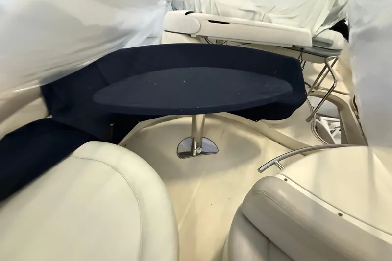 Slide: The Image of Interior seating area of 2008 Azimut 55 EVOLUTION yacht with table and cushioned seats. - 12