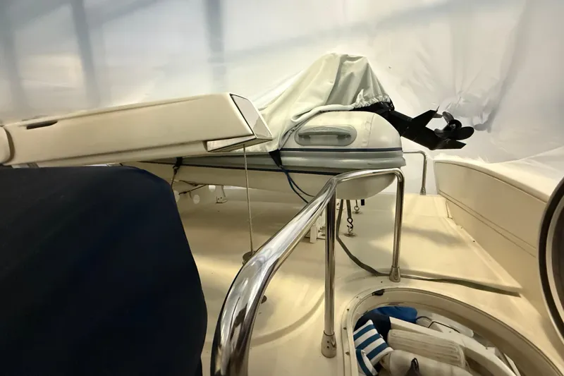 Slide: The Image of 2008 Azimut 55 EVOLUTION yacht deck with covered equipment and railing. - 13