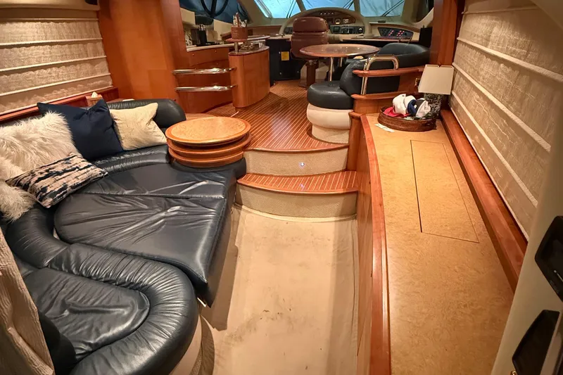 Slide: The Image of Luxurious interior of 2008 Azimut 55 EVOLUTION yacht with plush seating and elegant wood finishes. - 14