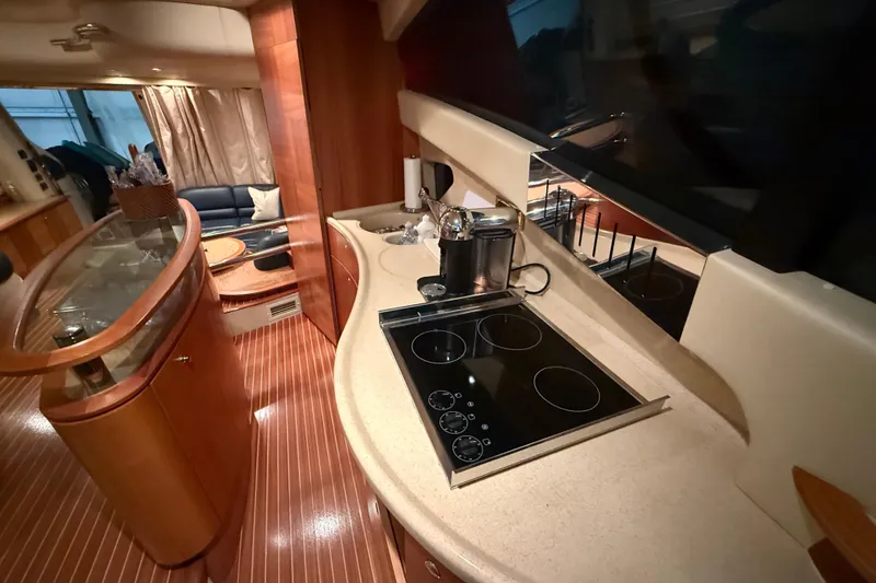 Slide: The Image of Luxurious interior of 2008 Azimut 55 EVOLUTION yacht with modern kitchen and seating area. - 18