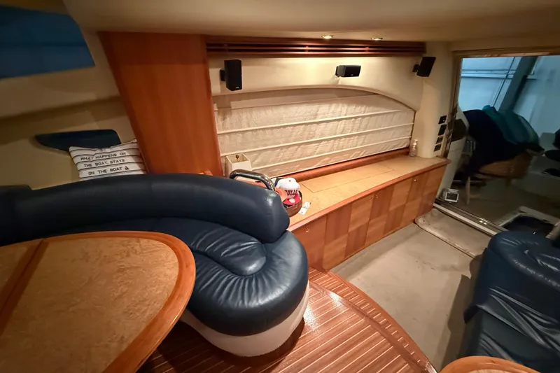 Slide: The Image of Luxurious interior of 2008 Azimut 55 EVOLUTION yacht with plush seating and wooden cabinetry. - 19