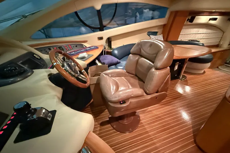 Slide: The Image of Luxurious interior of 2008 Azimut 55 EVOLUTION yacht with leather seating and wooden flooring. - 25
