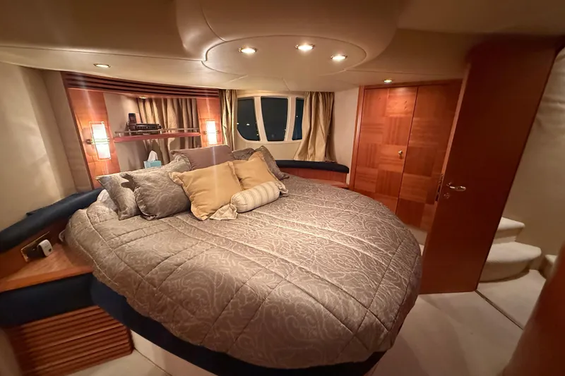 Slide: The Image of Luxurious bedroom interior of 2008 Azimut 55 EVOLUTION yacht with elegant bedding and warm lighting. - 28
