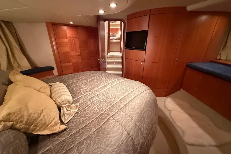 Slide: The Image of Luxurious bedroom interior of 2008 Azimut 55 EVOLUTION yacht with wood paneling and cozy bedding. - 29