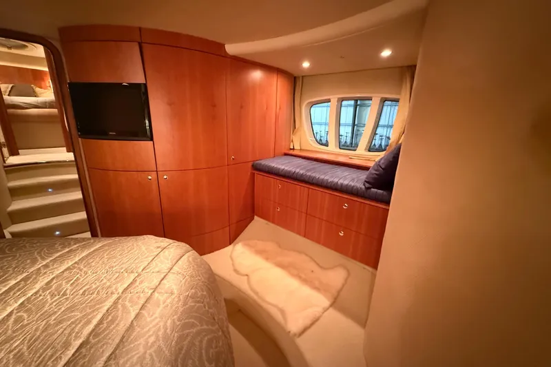 Slide: The Image of Luxurious interior of 2008 Azimut 55 EVOLUTION yacht with wood paneling and cozy seating. - 31