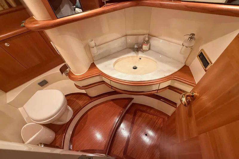 Slide: The Image of Luxurious 2008 Azimut 55 EVOLUTION yacht bathroom with elegant wood and marble finishes. - 33