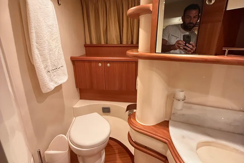Slide: The Image of Luxurious bathroom in 2008 Azimut 55 EVOLUTION yacht with wood accents and modern fixtures. - 34