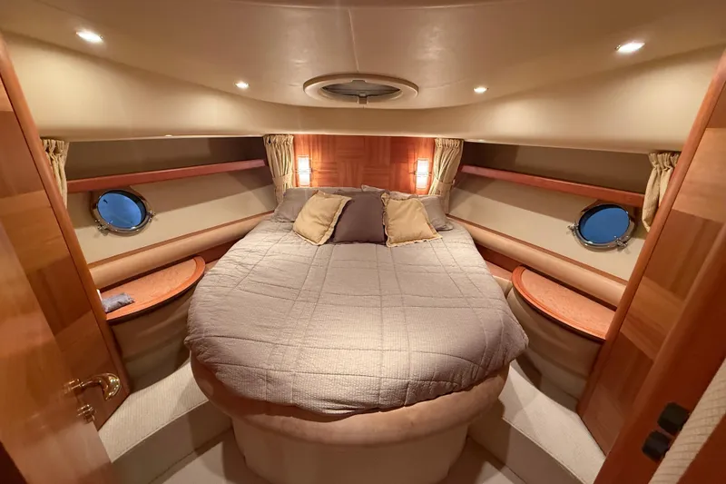 Slide: The Image of Luxurious bedroom interior of 2008 Azimut 55 EVOLUTION yacht with cozy lighting and elegant design. - 36