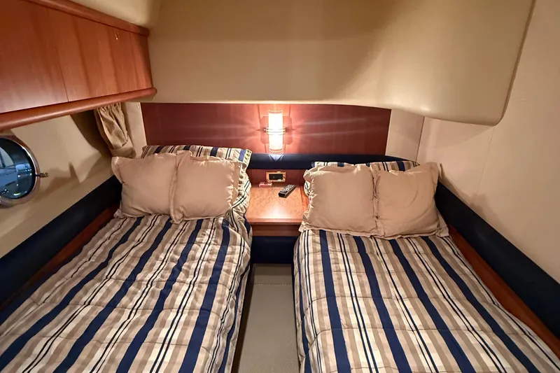 Slide: The Image of Twin cabin with striped bedding in 2008 Azimut 55 EVOLUTION yacht interior. - 44