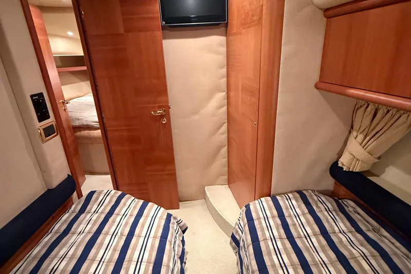 Slide: The Image of Twin cabin interior of 2008 Azimut 55 EVOLUTION yacht with striped bedding. - 45