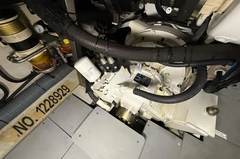 Slide: The Image of Engine room of 2008 Azimut 55 EVOLUTION yacht, showcasing mechanical components and serial number. - 51