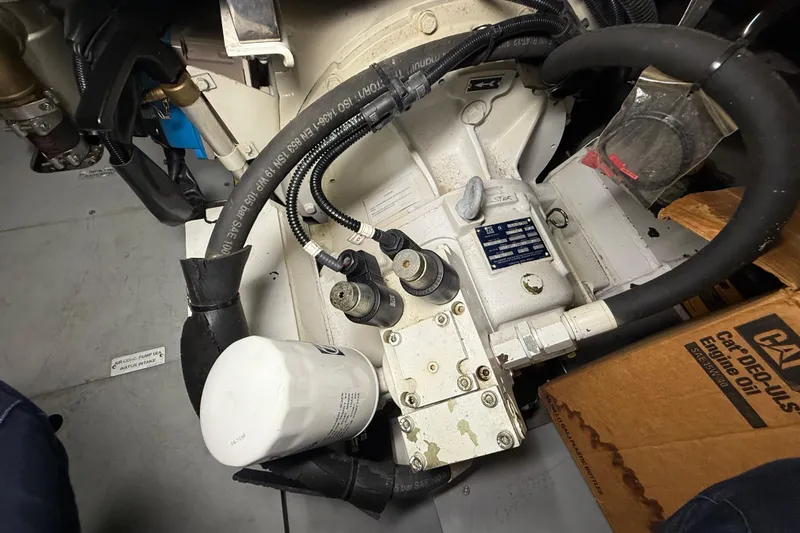 Slide: The Image of Engine compartment of 2008 Azimut 55 EVOLUTION yacht, featuring hoses and components. - 52