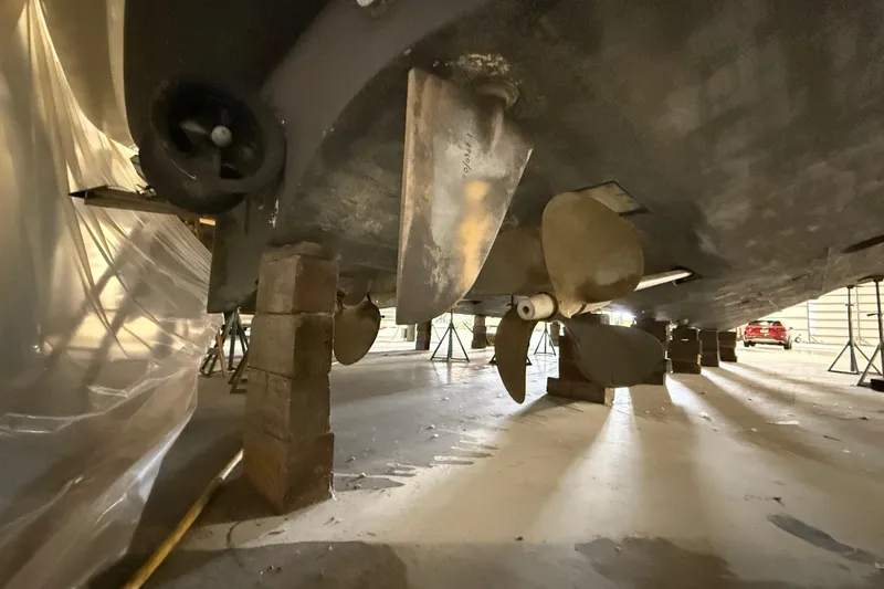 Slide: The Image of Underneath view of 2008 Azimut 55 EVOLUTION yacht, showcasing propellers and rudder. - 57