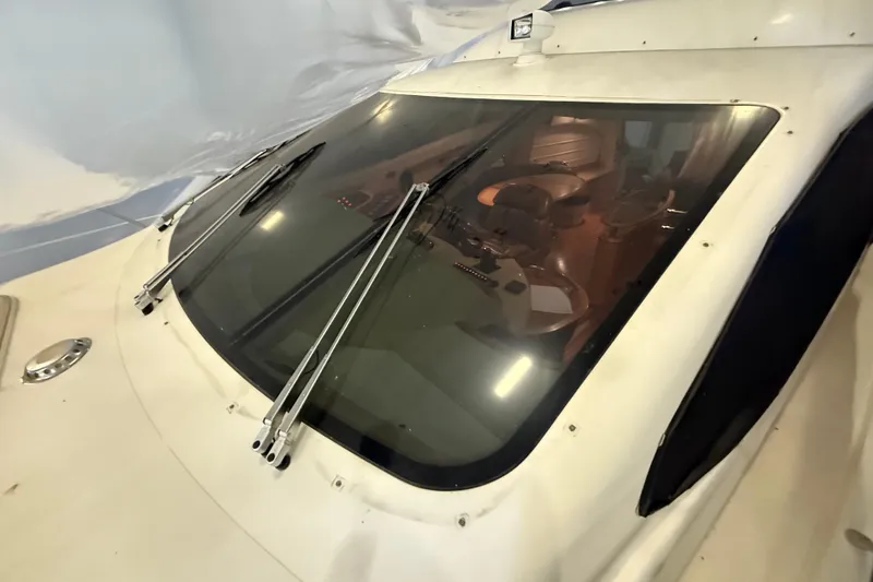 Slide: The Image of 2008 Azimut 55 EVOLUTION yacht windshield with wipers, showcasing interior helm area. - 7