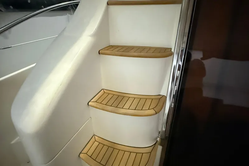 Slide: The Image of Staircase on 2008 Azimut 55 EVOLUTION yacht with wooden steps and sleek design. - 9
