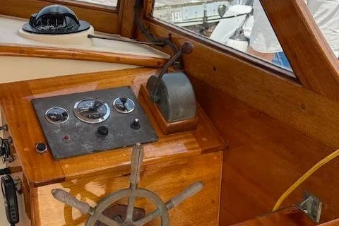 Slide: The Image of Wooden boat cockpit with steering wheel and control panel, Custom Gannon & Benjamin, 2005 model. - 10