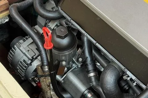 Slide: The Image of Close-up of a 2005 Custom Gannon & Benjamin engine with visible components and hoses. - 25