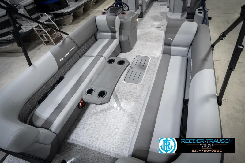 Slide: The Image of 2026 Bennington 25 SSR pontoon boat interior with gray seating and cup holders. - 12
