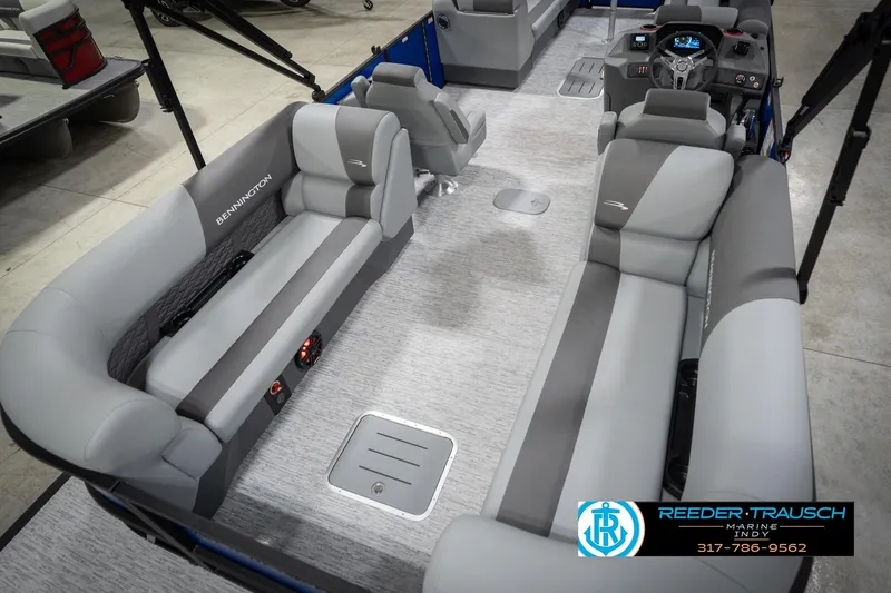 Slide: The Image of 2026 Bennington 25 SSR pontoon boat interior with gray seating and modern dashboard. - 14