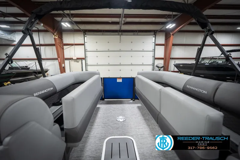 Slide: The Image of Interior view of 2026 Bennington 25 SSR pontoon boat in a showroom. - 23