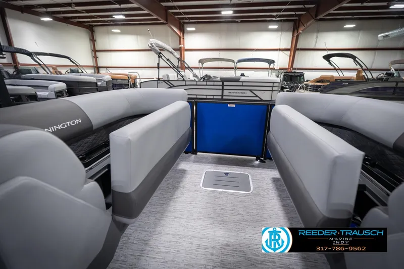 Slide: The Image of 2026 Bennington 25 SSR pontoon boat interior at Reeder-Trausch Marine showroom. - 29