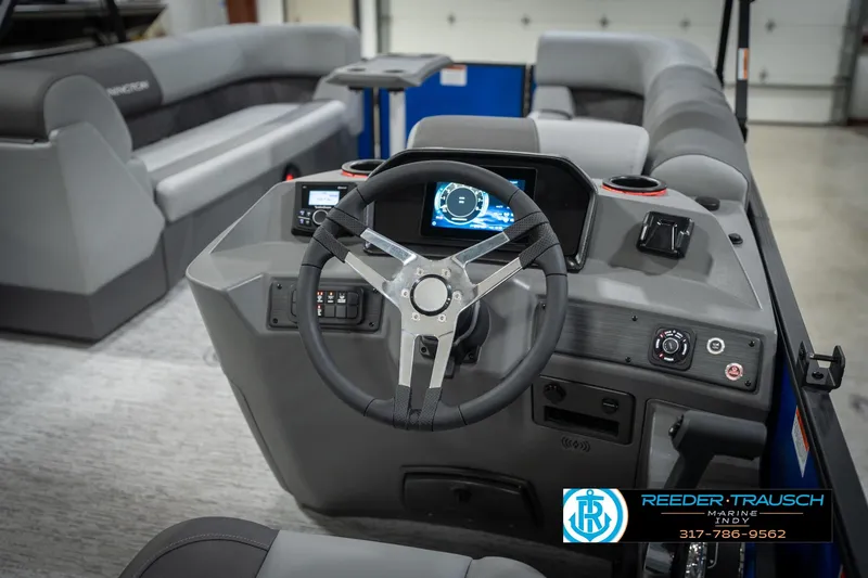 Slide: The Image of 2026 Bennington 25 SSR boat interior with modern steering console and seating. - 30