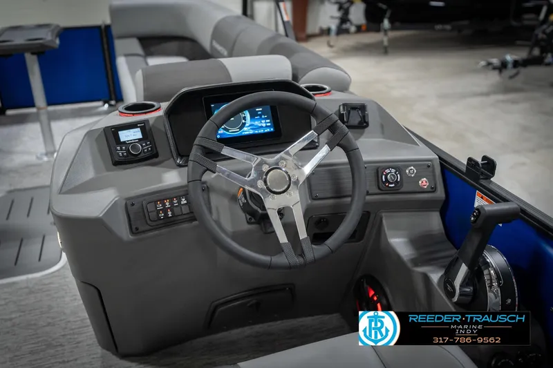 Slide: The Image of 2026 Bennington 25 SSR boat dashboard with steering wheel and control panel. - 31