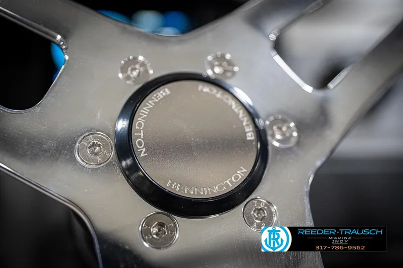 Slide: The Image of Close-up of 2026 Bennington 25 SSR steering wheel with logo and bolts. - 32