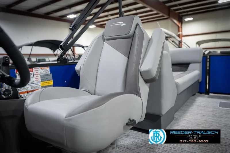 Slide: The Image of 2026 Bennington 25 SSR boat interior with modern seating and steering wheel. - 40