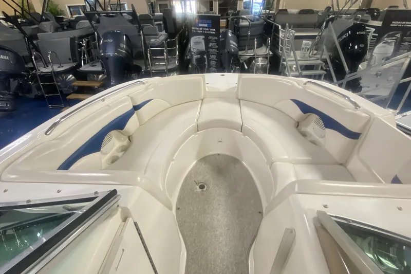 Slide: The Image of 2002 Chaparral Sunesta 243 boat interior with spacious seating and modern design. - 2