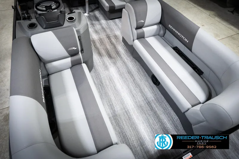 Slide: The Image of 2026 Bennington 188 SLJ boat interior with modern seating and steering console. - 13