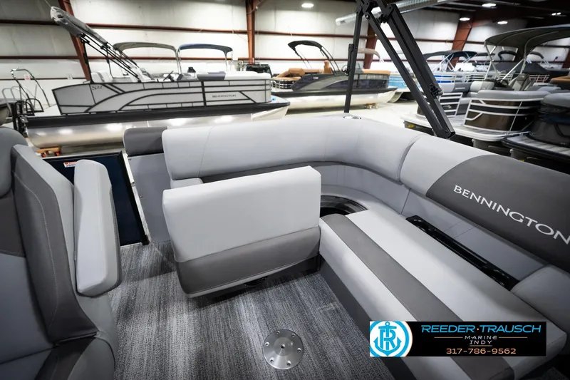 Slide: The Image of 2026 Bennington 188 SLJ boat interior with gray captain's chair and steering wheel. - 26