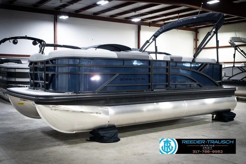 Slide: The Image of 2026 Bennington 188 SLJ pontoon boat in showroom, front view. - 3