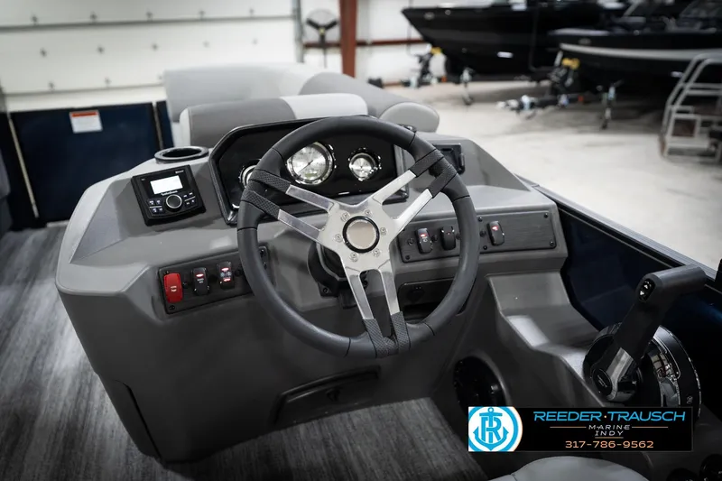 Slide: The Image of Control panel of 2026 Bennington 188 SLJ with horn, radio, navigation, and dock light switches. - 32