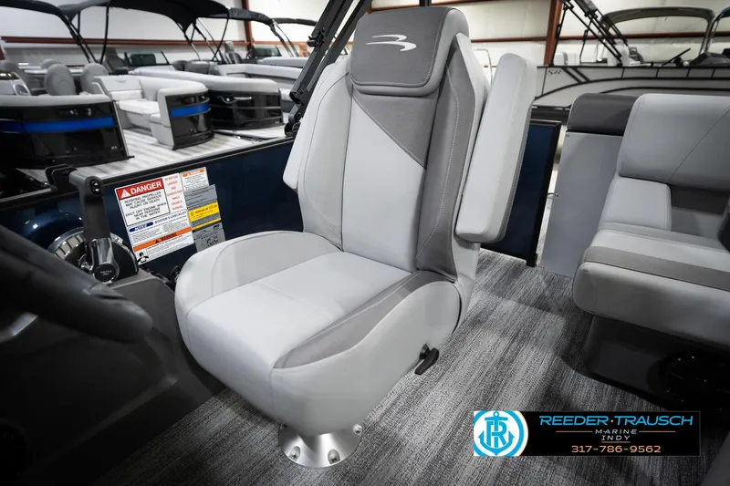 Slide: The Image of 2026 Bennington 188 SLJ boat interior with gray and white cushioned seating. - 40