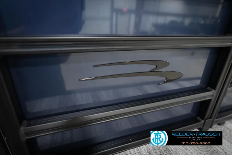 Slide: The Image of 2026 Bennington 188 SLJ boat with "S18" emblem, Reeder-Trausch Marine logo visible. - 49