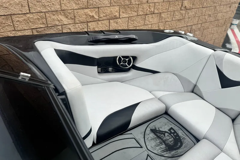 Slide: The Image of 2015 Centurion Enzo FS44 boat interior with stylish black and white seating design. - 11