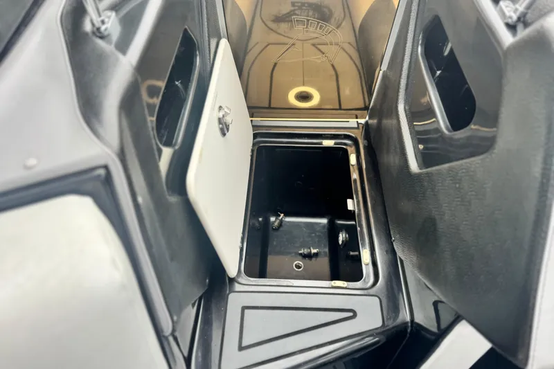 Slide: The Image of 2015 Centurion Enzo FS44 boat storage compartment with open hatch, showcasing interior details. - 15