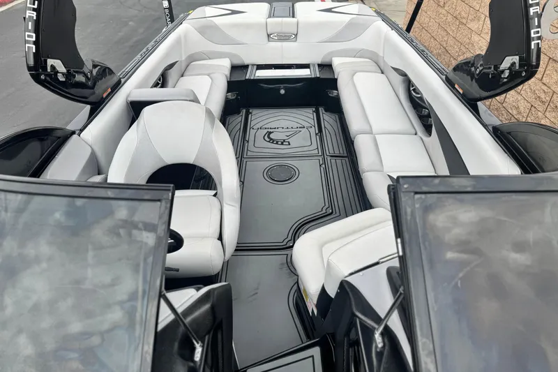 Slide: The Image of 2015 Centurion Enzo FS44 boat interior with sleek seating and modern design. - 16
