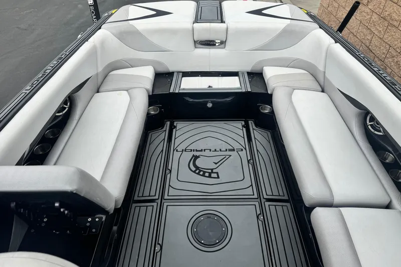 Slide: The Image of 2015 Centurion Enzo FS44 boat interior with sleek seating and stylish flooring design. - 17