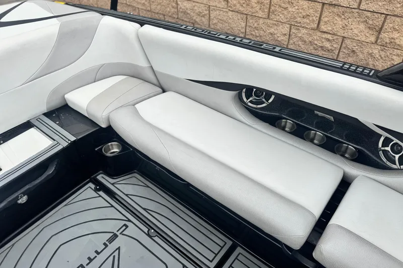Slide: The Image of 2015 Centurion Enzo FS44 boat interior with white seating and cup holders. - 23