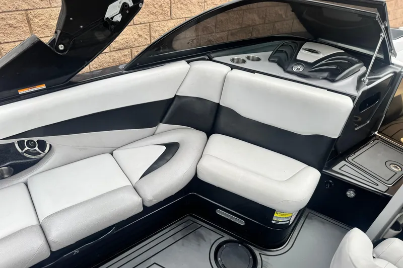 Slide: The Image of 2015 Centurion Enzo FS44 boat interior with sleek black and white seating. - 29