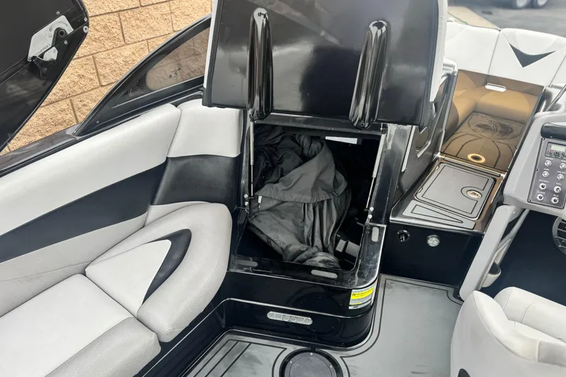 Slide: The Image of 2015 Centurion Enzo FS44 boat interior with open storage compartment. - 31